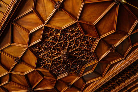 Lednice, Southern Moravia, Czech Republic, 04 July 2021: Castle interior with neo-gothic carved furniture, Details of a beautiful wooden ceiling with floral ornaments, UNESCO World Heritage chateau.のeditorial素材