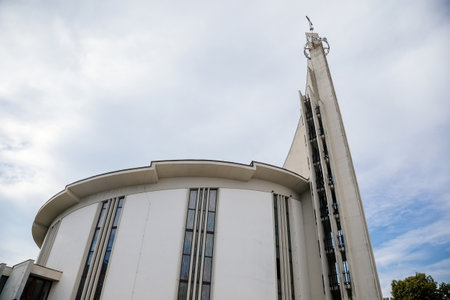 Hustopece, Southern Moravia, Czech Republic, 04 July 2021: Modern Church of St. Wenceslas and St. Agnes Czech with spire at main square at sunny summer day in historic center.のeditorial素材