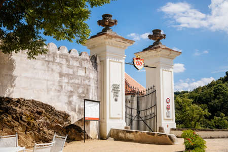 Vranov nad dyji, Southern Moravia, Czech Republic, 03 July 2021: entrance to baroque and gothic medieval castle on hill on river bank at sunny summer day, gate and courtyard against the blue sky.のeditorial素材