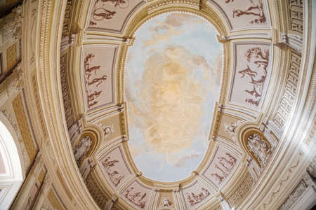 Vranov nad dyji, Southern Moravia, Czech Republic, 03 July 2021: Castle interior of monumental baroque Hall with frescoes and marble statues, 3D painted walls, oval ceiling with sky and clouds.のeditorial素材