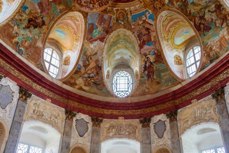 Vranov nad dyji, Southern Moravia, Czech Republic, 03 July 2021: Castle interior of monumental baroque Hall of Ancestors with frescoes and marble statues, painted walls and shrouds, oval windows.のeditorial素材