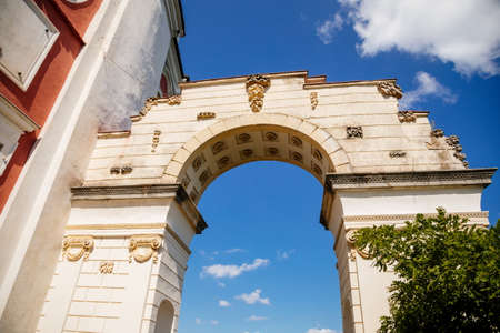 Vranov nad dyji, Southern Moravia, Czech Republic, 03 July 2021: entrance to baroque and gothic medieval castle on hill at sunny summer day, arch twined with rose bushes against the blue sky.のeditorial素材