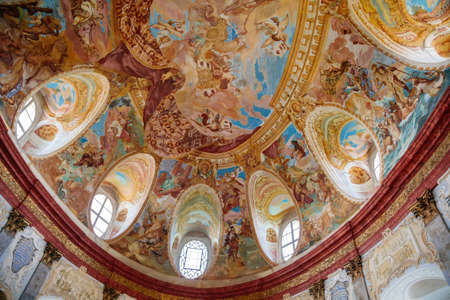 Vranov nad dyji, Southern Moravia, Czech Republic, 03 July 2021: Castle interior of monumental baroque Hall of Ancestors with frescoes and marble statues, painted walls and shrouds, oval windows.のeditorial素材