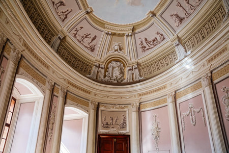 Vranov nad dyji, Southern Moravia, Czech Republic, 03 July 2021: Castle interior of monumental baroque Hall with frescoes and marble statues, 3D painted walls, oval ceiling with sky and clouds.のeditorial素材