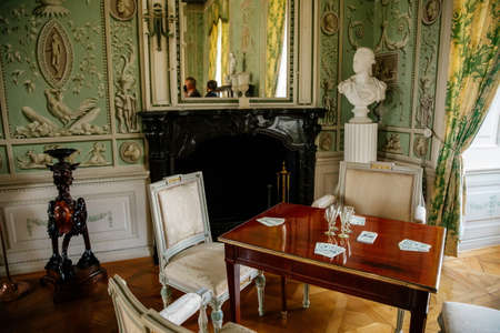 Vranov nad dyji, Southern Moravia, Czech Republic, 03 July 2021: Castle interior, baroque wooden carved furniture, green guest salon, painted walls, floral ornament,のeditorial素材