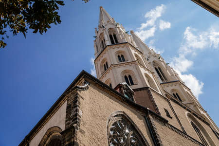 Goerlitz, Germany, 04 September 2021: gothic medieval St. Peter and Paul Church or Peterskirche with two white towers in historical center of city near river at sunny summer day, arched portal.のeditorial素材