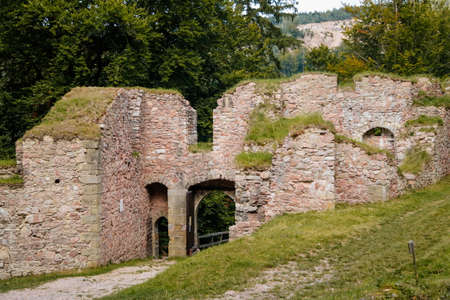 Litice nad Orlici, Eastern Bohemia, Czech Republic, 11 September 2021: Ruins of medieval castle on hill, old stronghold, arched entrance gate, ancient fortress at sunny day, landmark in countryside.のeditorial素材
