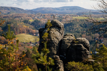 Basteiaussicht or Bastei Rock Formations in Elbe River Valley, Sandstone Mountains Path, autumn forest landscape at sunny day, rocky valleyの写真素材