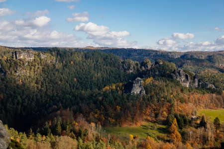 Basteiaussicht or Bastei Rock Formations in Elbe River Valley, Sandstone Mountains Path, autumn forest landscape at sunny day, rocky valleyの写真素材