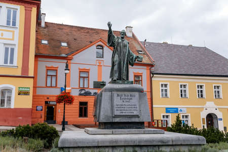 Louny, Czech Republic, 19 September 2021: Monument to Master Jan Hus at main Peace square or Mirove namesti at autumn day, author Josef Kvasnicka, Hus in a typical preachers poseのeditorial素材