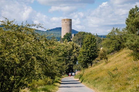 Tocnik, Central Bohemia, Czech Republic, 31 July 2021: Ruins of medieval castle Zebrak on hill, old stronghold with stone tower, ancient gothic fortress at summer sunny day, landmark in countrysideのeditorial素材