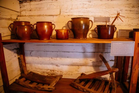 Kourim, Bohemia, Czech Republic, 26 December 2021: Interior of Traditional village house, barn with agricultural tools, troughs and clamps, country-style architecture, open-air ethnographic museumのeditorial素材