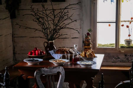 Kourim, Bohemia, Czech Republic, 26 December 2021: Interior of Traditional village house, set table...