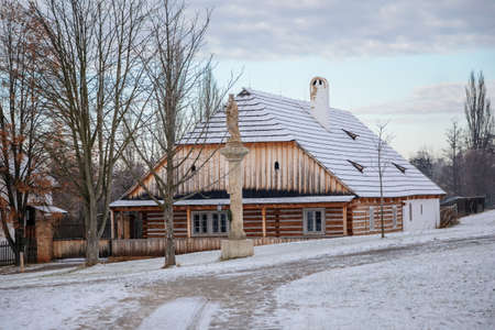 Kourim, Central Bohemia, Czech Republic, 26 December 2021: Traditional rural village wooden house in winter, historic country-style architecture, Christmas in Skanzen, open-air ethnographic museumのeditorial素材