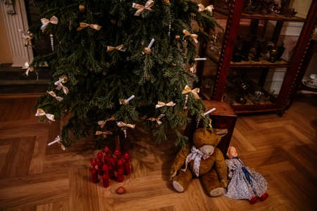 Kolin, Czech Republic, 26 December 2021: Regional Museum Town House Cervinkovsky dum, Interior with Biedermeier style furniture, Christmas tree and decorations, white bows and candles, gifts and toysのeditorial素材