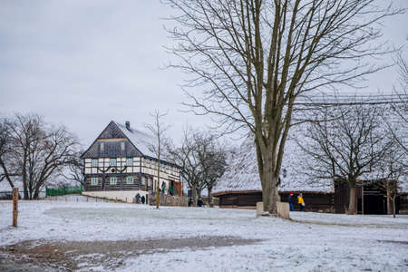 Kourim, Central Bohemia, Czech Republic, 26 December 2021: Traditional rural village wooden house in winter, historic country-style architecture, Christmas in Skanzen, open-air ethnographic museumのeditorial素材