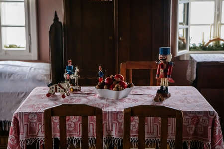 Kourim, Czech Republic, 26 December 2021: Interior of Traditional village house, children's room with beds by window and wooden toys, country-style architecture, open-air ethnographic museumのeditorial素材