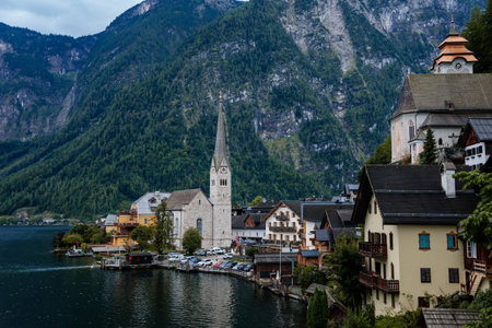 Hallstatt, Austria, 27 August 2021: Colorful scenic picturesque town street at summer day, mountain...