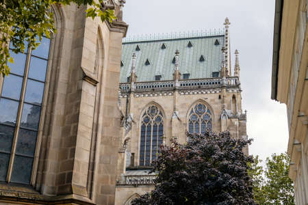 Linz, Austria, 27 August 2021: Facade of medieval catholic stone gothic New Cathedral of Immaculate Conception with arch, old town street at sunny summer day, lancet windows and carved statuesのeditorial素材
