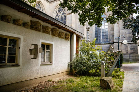 Linz, Austria, 27 August 2021: Facade of medieval catholic stone gothic New Cathedral of Immaculate Conception with arch, old town street at sunny summer day, lancet windows and carved statuesのeditorial素材