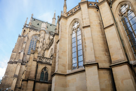 Linz, Austria, 27 August 2021: Facade of medieval catholic stone gothic New Cathedral of Immaculate Conception with arch, old town street at sunny summer day, lancet windows and carved statuesのeditorial素材