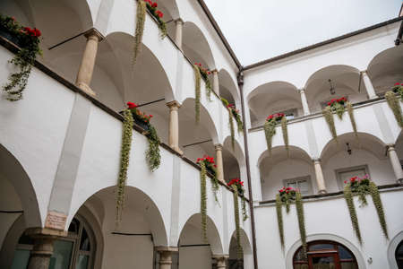 Linz, Austria, 29 August 2021: Landhaus Parliament of Upper Austria, Facade of colorful baroque buildings in historic center of medieval city, summer day, fountain Planetenbrunnen, renaissance arcadesのeditorial素材