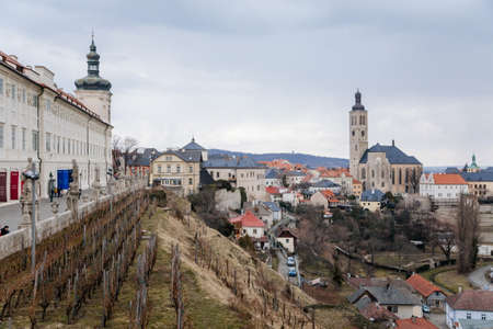 Kutna Hora, Central Bohemia, Czech Republic, 5 March 2022: Baroque Former Jesuit College with tower and dome, medieval architecture gothic and renaissance at old town, vineyards on a slopeのeditorial素材