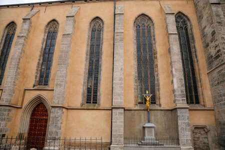 Kutna Hora, Central Bohemian, Czech Republic, 5 March 2022: Gothic stone Church of St. James or Kostel sv. Jakuba with bell and clock tower, medieval architecture at old town, lancet windowsのeditorial素材