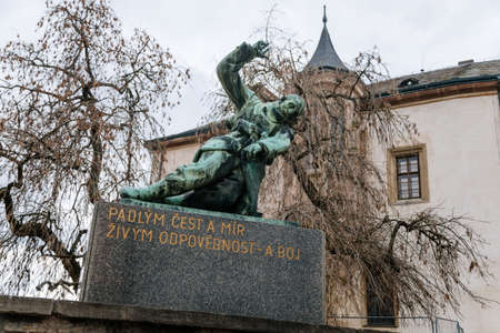Kutna Hora, Czech Republic, 5 March 2022: Narrow picturesque street with colorful renaissance and baroque buildings in center in medieval city, Museum of Silver and monument to those who died in warsのeditorial素材
