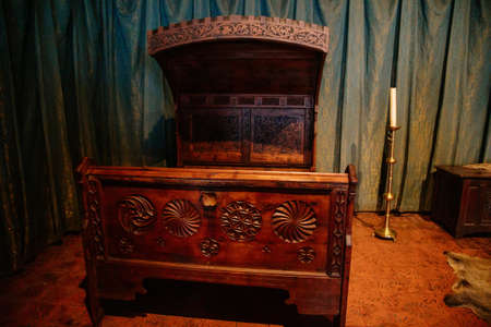 Karlstejn, Czech Republic, 12 March 2022: medieval gothic castle interior, antique wood carved...