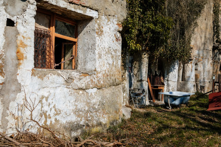 Truskavna Czech Republic, 19 March 2022: Rock apartment, abandoned house, broken open window, old bathroom, formation and protected landscape area in Kokorinsko, sandstone cliffs at sunny dayのeditorial素材