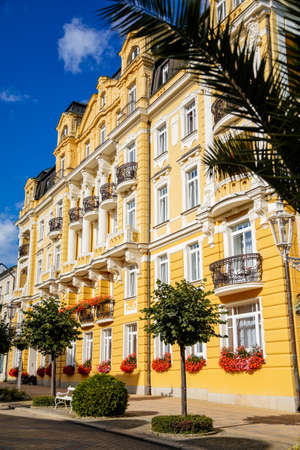 Frantiskovy Lazne, Western Bohemia, Czech Republic, 14 August 2021: Spa house or hotel on main street Narodni, White and yellow baroque historical building, town Franzensbad at sunny summer dayのeditorial素材