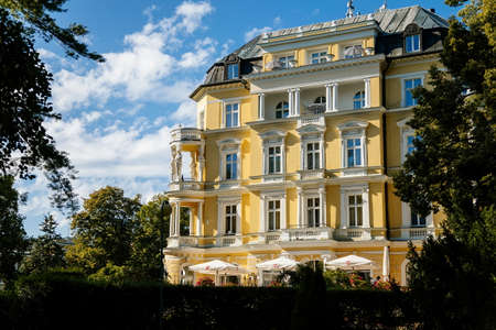 Frantiskovy Lazne, Western Bohemia, Czech Republic, 14 August 2021: White and yellow imperial Spa House, spa park and famous spa town Franzensbad at sunny day, Neo-renaissance historical buildingのeditorial素材