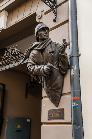 Riga, Latvia, 14 October 2021: bronze statue of Sherlock Holmes, Facade of colorful buildings in historic center of medieval city, renaissance and baroque houses at summer sunny dayのeditorial素材