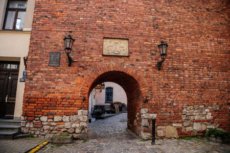 Riga, Latvia, 14 October 2021: gothic medieval historic fortress with stone defense walls, stronghold in sunny summer day, Facade of colorful buildings in historic center, renaissance housesのeditorial素材