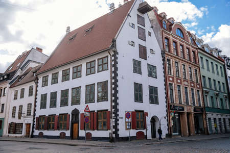 Riga, Latvia, 14 October 2021: Narrow picturesque street, Facade of colorful buildings in historic...
