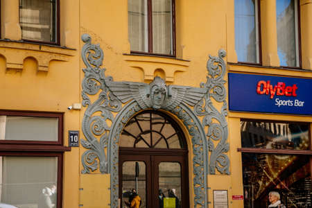 Riga, Latvia, 19 October 2021: Beautiful facade of colorful residential art nouveau secession building in old town, Sculptures and decorative elements of Modern and Art Deco styles at sunny dayのeditorial素材