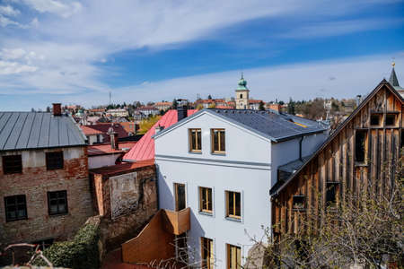 Litomysl, Czech Republic, 17 April 2022: narrow picturesque street with medieval colorful gothic merchant houses at sunny summer day, historic renaissance and baroque buildings, medieval churchのeditorial素材