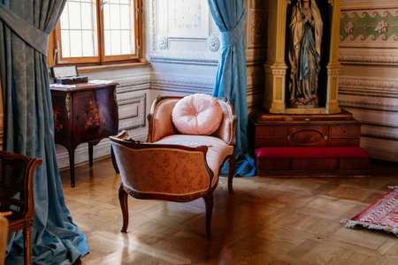 Litomysl, Czech Republic, 17 April 2022: castle chateau baroque representative interior with baroque classic furniture, soft carved sofa and armchairs, paintings and mirrors on the wallsのeditorial素材