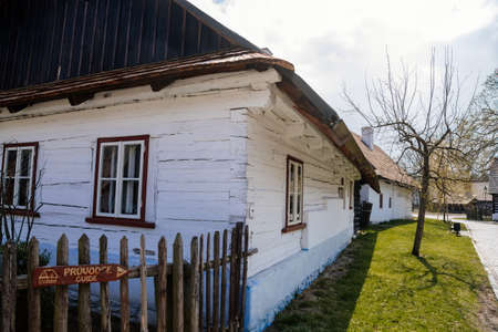 Hlinsko, Vysocina, Czech Republic, 15 April 2022: Traditional village wooden farm house at summer sunny day, historic country-style architecture in Skanzen, Easter at Open-air museum Betlem Hlinskoのeditorial素材