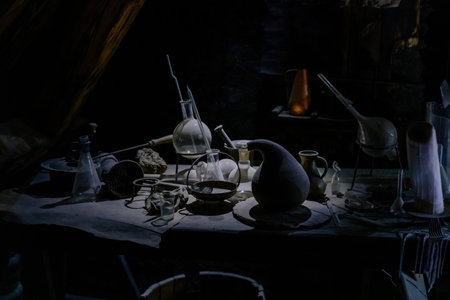 Prague, Czech Republic, 2 October 2022: Museum of Alchemists and Magicians, flasks, retorts and other chemical glassware and equipment for experiments in laboratory, Mystic manuscripts and herbsのeditorial素材