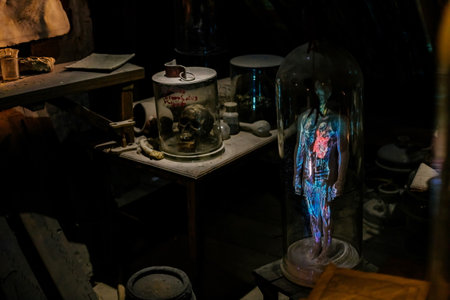 Prague, Czech Republic, 2 October 2022: Museum of Alchemists and Magicians, flasks, retorts and other chemical glassware and equipment for experiments in laboratory, Mystic manuscripts and homunculusのeditorial素材