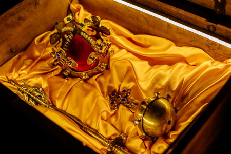 Krivoklat, Czech Republic, 21 August 2022: fortified medieval royal gothic castle, National cultural landmark, museum interior with royal treasures, golden crown with precious stones, scepter and orbのeditorial素材