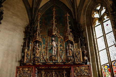 Krivoklat, Czech Republic, 21 August 2022: fortified medieval royal gothic castle, National cultural landmark, chapel interior with wooden carved altar depicting Jesus Christ and the Virgin Maryのeditorial素材