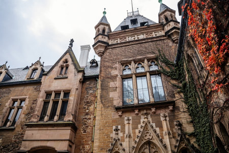 Wernigerode, Saxony-Anhalt, Germany, 29 October 2022: Castle with tower in Harz mountains above town, Neo-Romantic style or historicism, Sculptures of griffins, dragon and eagles, sunny autumn dayのeditorial素材