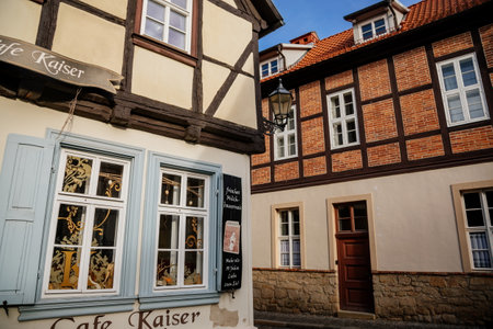 Quedlinburg, Saxony-Anhalt, Germany, 28 October 2022: Historic old vintage colored timber frame houses in medieval town, UNESCO World Heritage city, half-timbered home at sunny autumn day, cobblestoneのeditorial素材