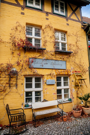 Quedlinburg, Saxony-Anhalt, Germany, 28 October 2022: Historic old vintage colored timber frame houses in medieval town, UNESCO World Heritage city, half-timbered home at sunny autumn day, cobblestoneのeditorial素材