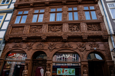 Wernigerode, Saxony-Anhalt, Germany, 29 October 2022: Krummelsches Haus or Krummel's house, Historic old vintage colored timber frame houses with carvings in medieval town, home at sunny dayのeditorial素材