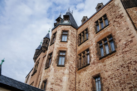 Wernigerode, Saxony-Anhalt, Germany, 29 October 2022: Castle with tower in Harz mountains above town, Neo-Romantic style or historicism, Sculptures of griffins, dragon and eagles, sunny autumn dayのeditorial素材
