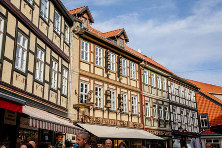 Wernigerode, Saxony-Anhalt, Germany, 29 October 2022: Historic old vintage colored timber frame houses in medieval town, UNESCO World Heritage city, half-timbered home at sunny autumn day, cobblestoneのeditorial素材